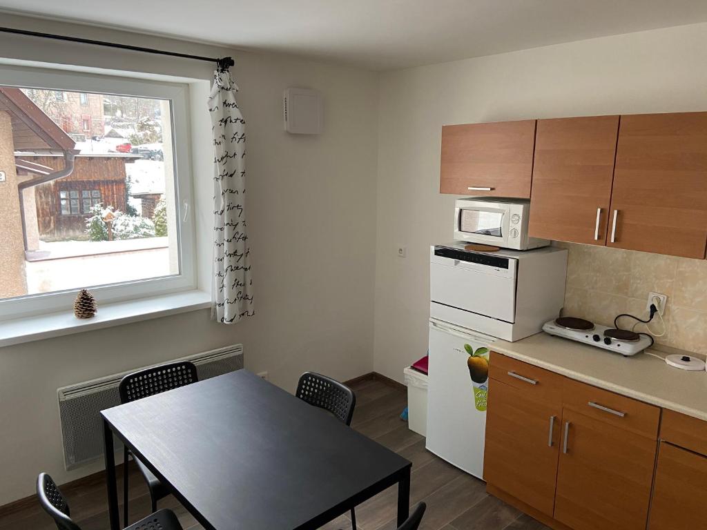 Kuchyň nebo kuchyňský kout v ubytování Apartmány Viktorka