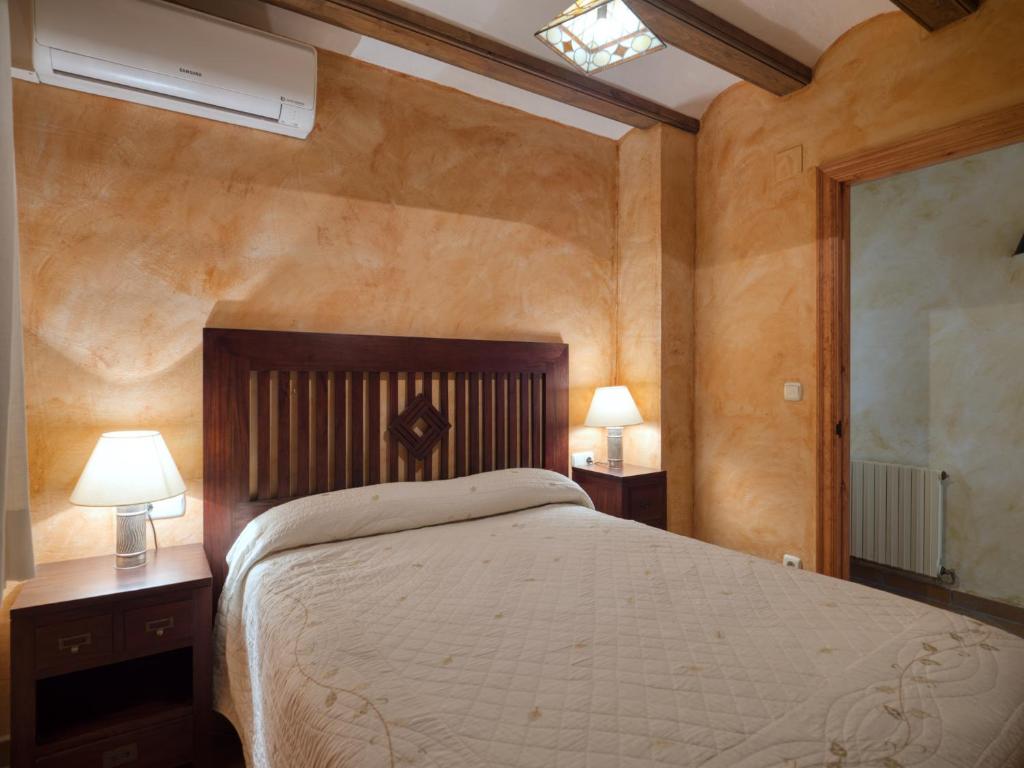 Postel nebo postele na pokoji v ubytování Casa del Moliner