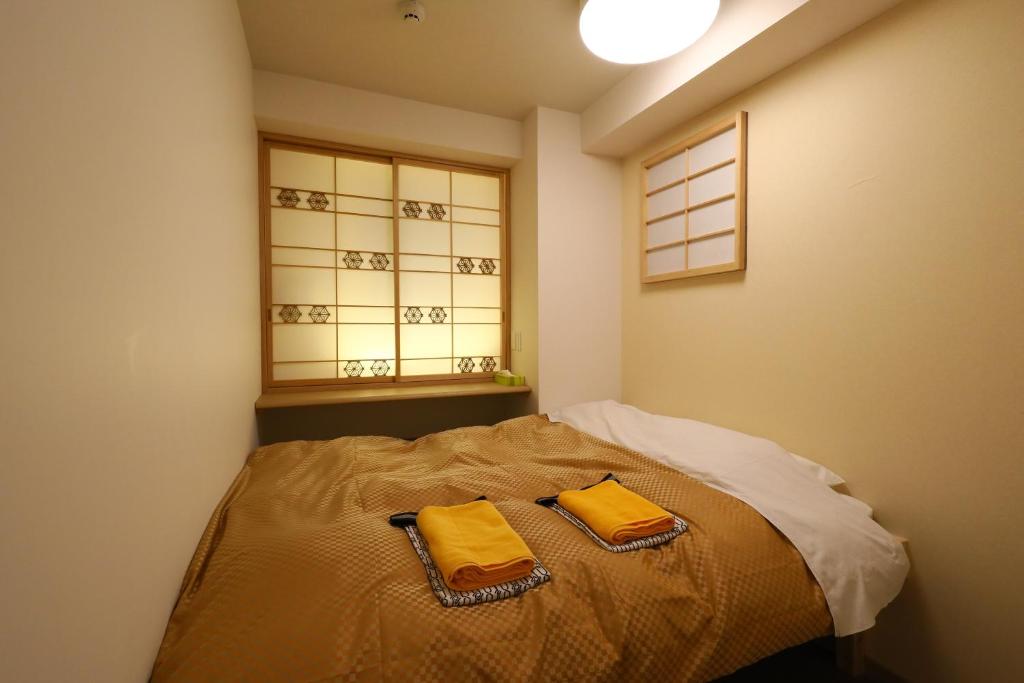 Postel nebo postele na pokoji v ubytování Wa Style Tokyo