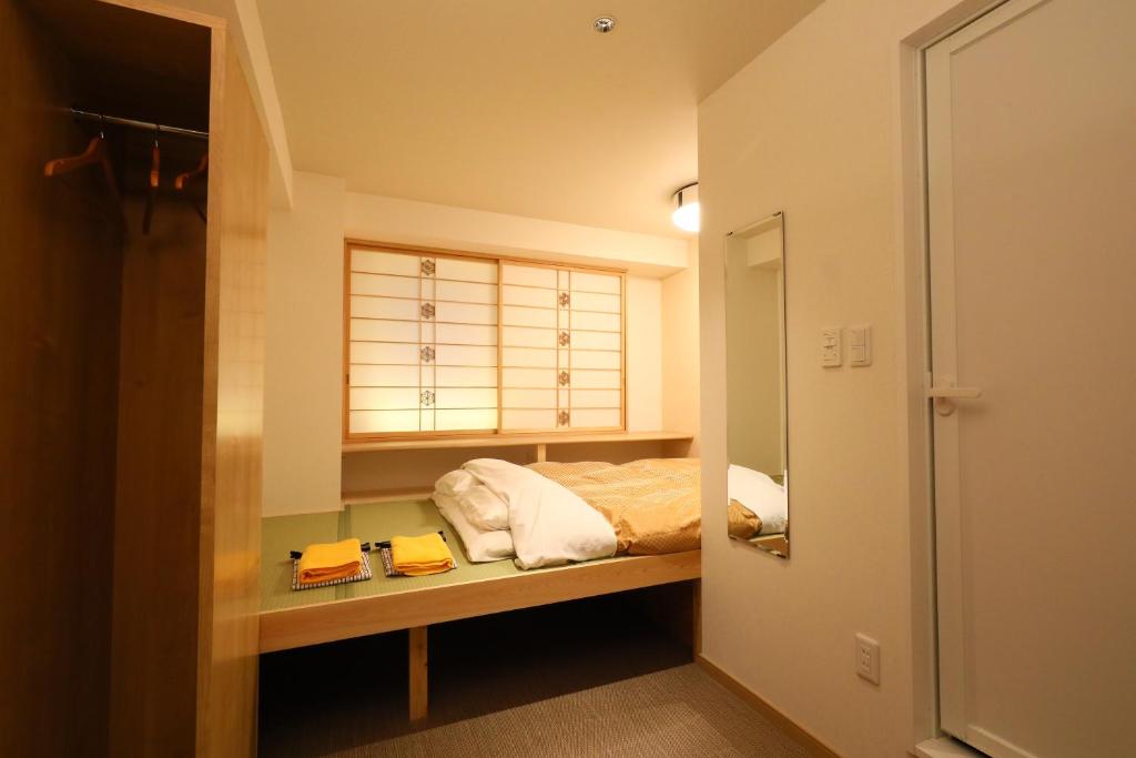 Postel nebo postele na pokoji v ubytování Wa Style Tokyo