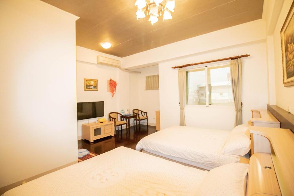 מיטה או מיטות בחדר ב-Wenxin Homestay