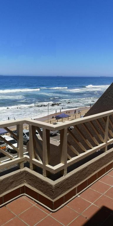 a view of the beach and the ocean from a building at 26 Isikhulu in Umdloti
