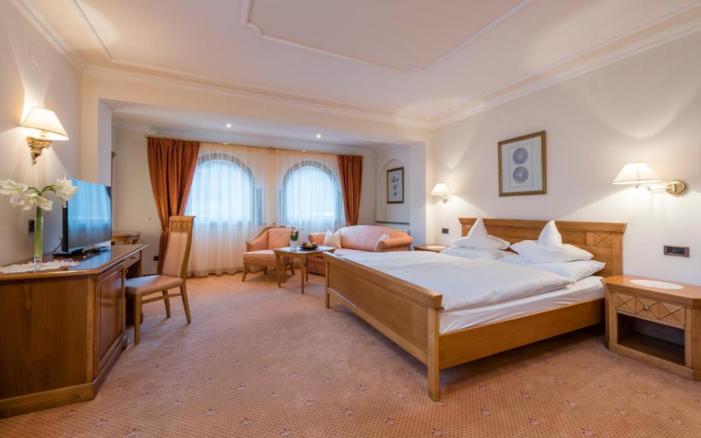 Кровать или кровати в номере Romantik Hotel & Restaurant Stafler