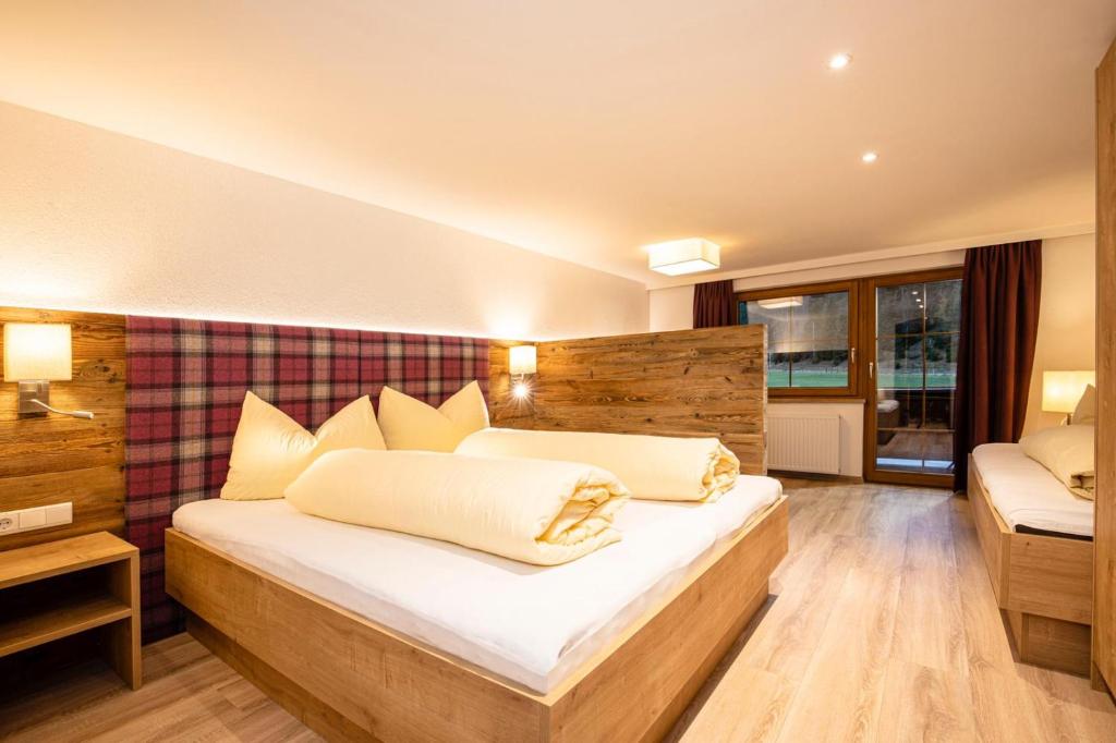 Postel nebo postele na pokoji v ubytování Appartements Schrambacherhof