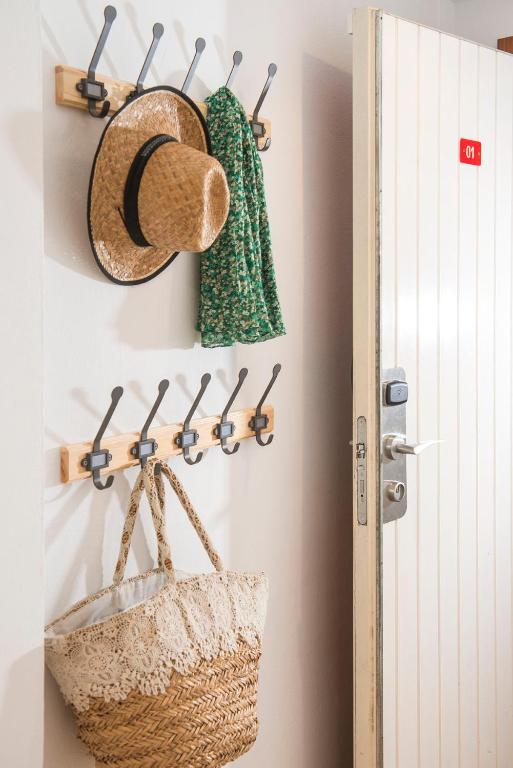a room with hats and baskets on a wall at Apartaments Els Llorers in Lloret de Mar
