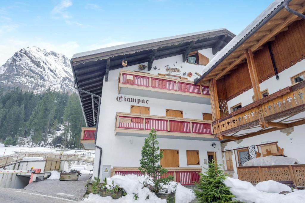 a hotel in the mountains with snow on the ground at Cesa Ciampac 5 in Alba di Canazei