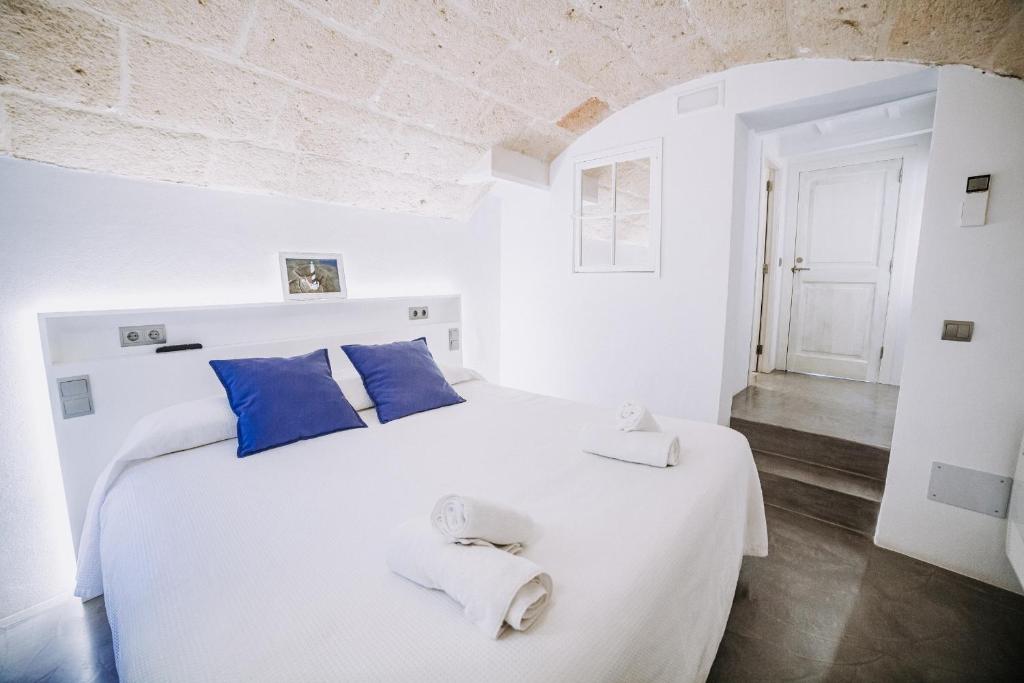 Postel nebo postele na pokoji v ubytování Petit Hotel 5 Fars