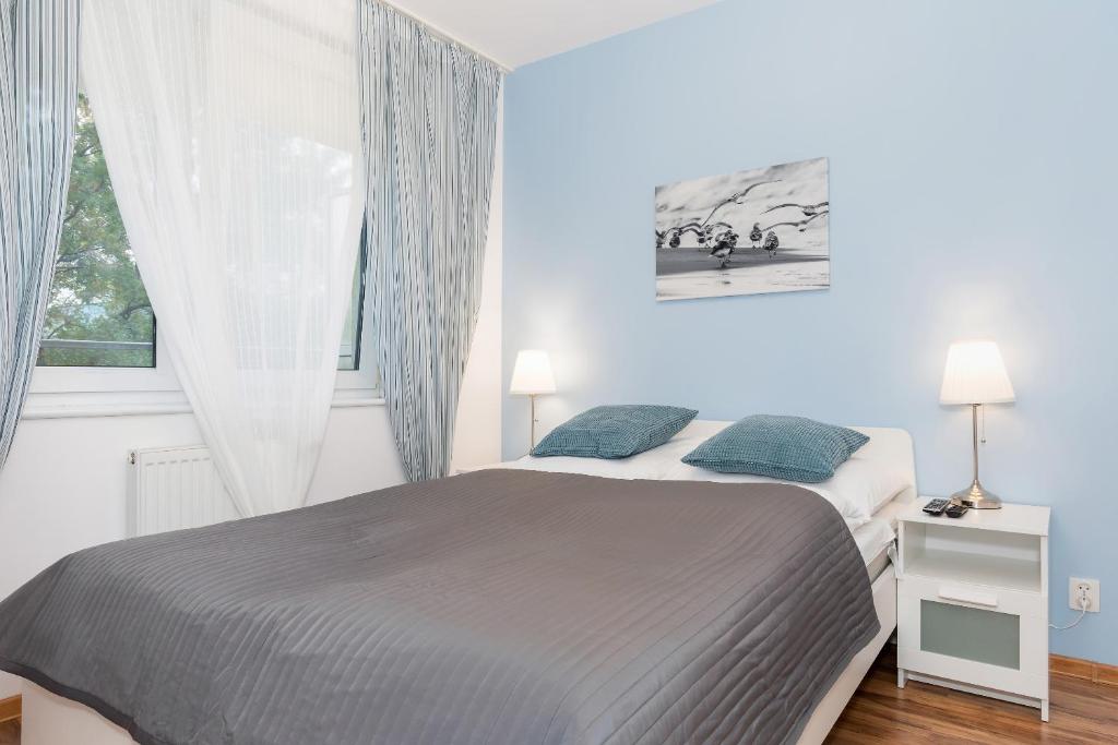 Posteľ alebo postele v izbe v ubytovaní Jantar Apartamenty- Zielone Tarasy