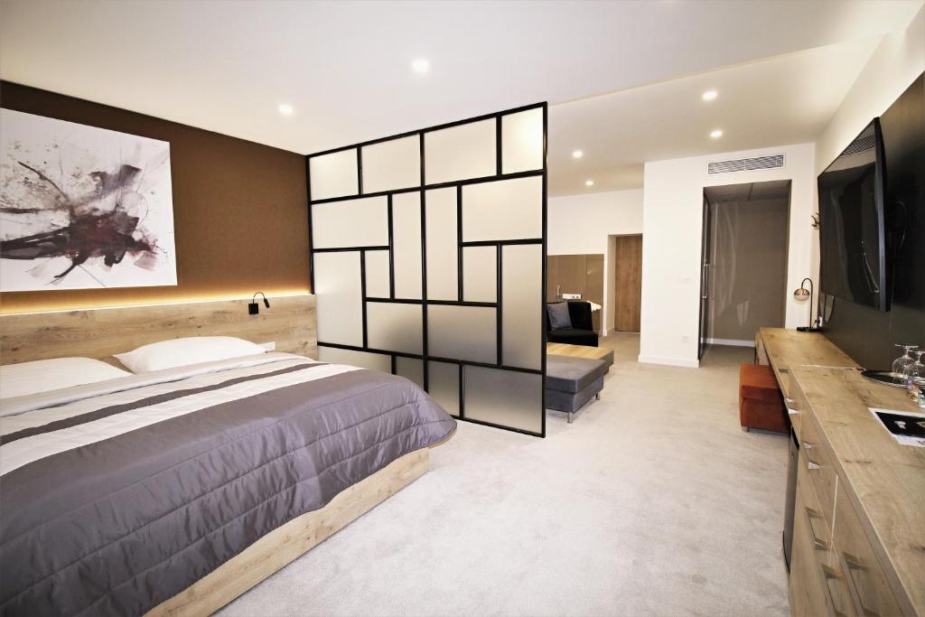 Postel nebo postele na pokoji v ubytování Hotel Magnus Trenčín