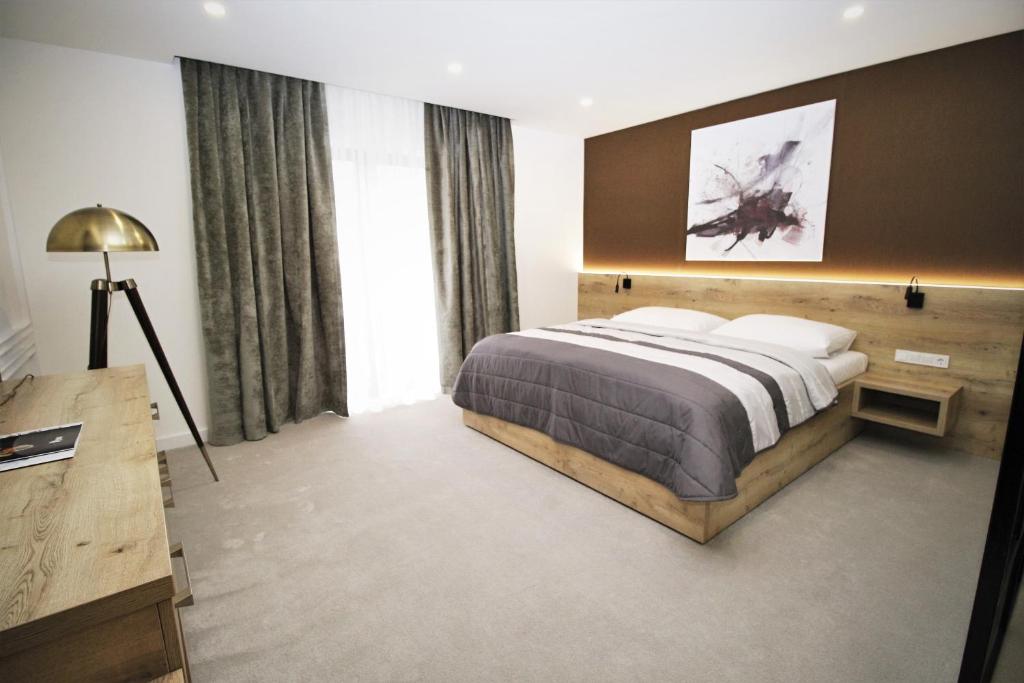 Postel nebo postele na pokoji v ubytování Hotel Magnus Trenčín