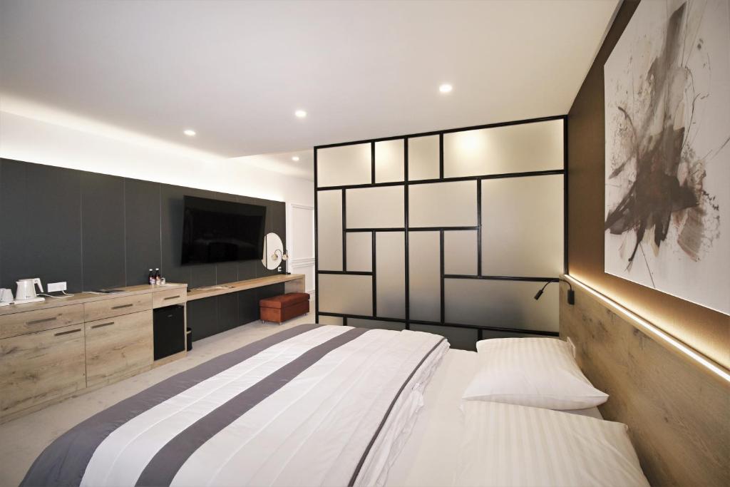 Postel nebo postele na pokoji v ubytování Hotel Magnus Trenčín