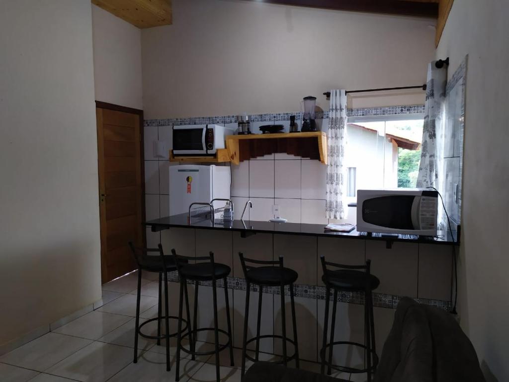 Kuchyň nebo kuchyňský kout v ubytování casa temporada capitólio
