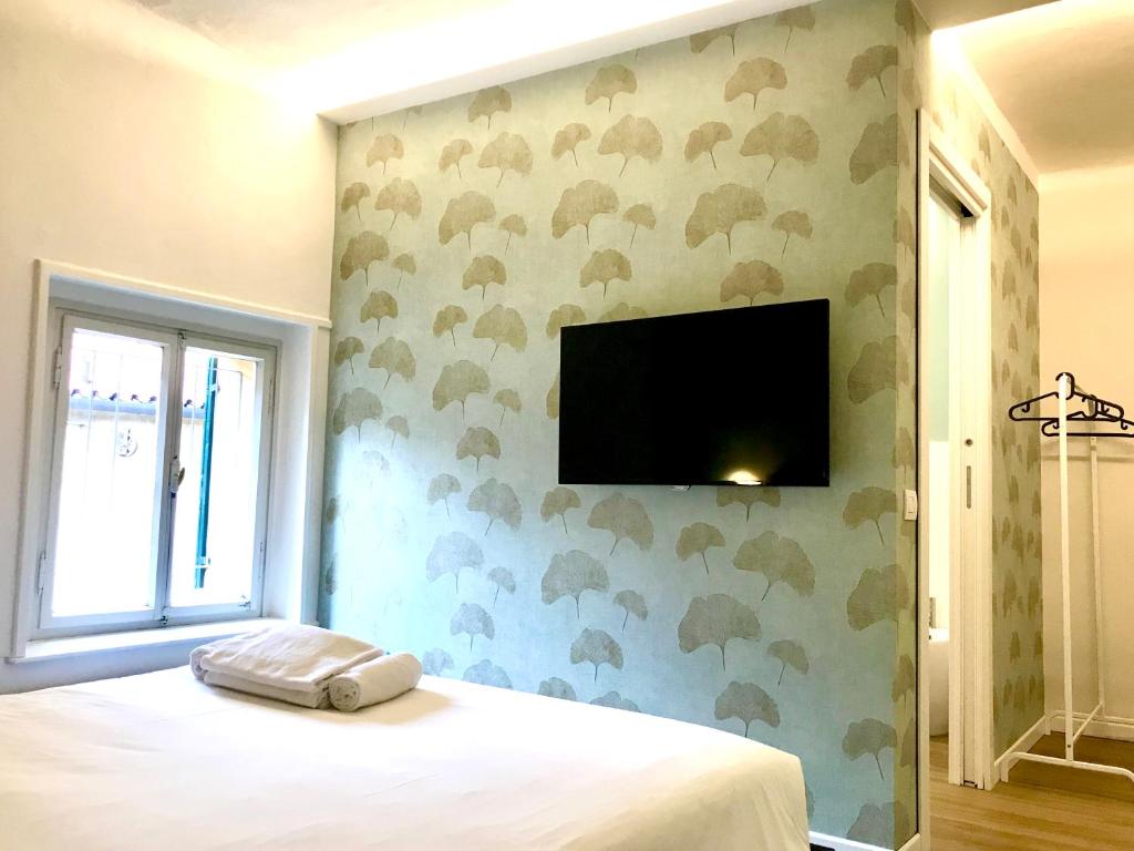 Telewizja i/lub zestaw kina domowego w obiekcie Room Verona Ai Conti