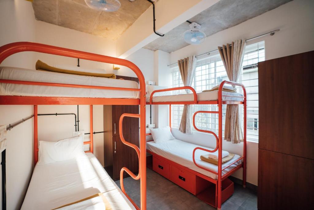 Postel nebo postele na pokoji v ubytování Draper Startup House ,Koramangala