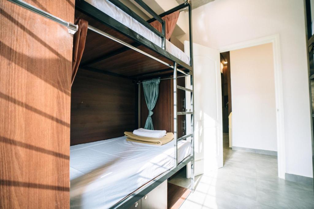 Postel nebo postele na pokoji v ubytování Draper Startup House ,Koramangala