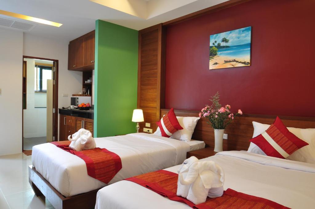 Postel nebo postele na pokoji v ubytování Samui Honey Tara Villa Residence