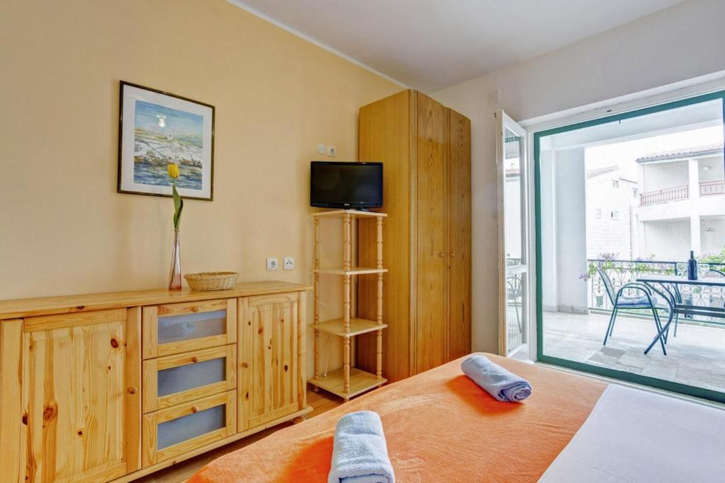 Posteľ alebo postele v izbe v ubytovaní Beach Apartments Anton
