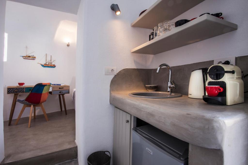 Kuchyň nebo kuchyňský kout v ubytování Cupola Suites