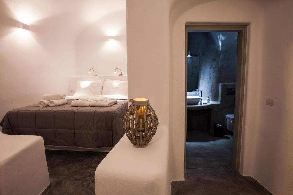Postel nebo postele na pokoji v ubytování Cupola Suites