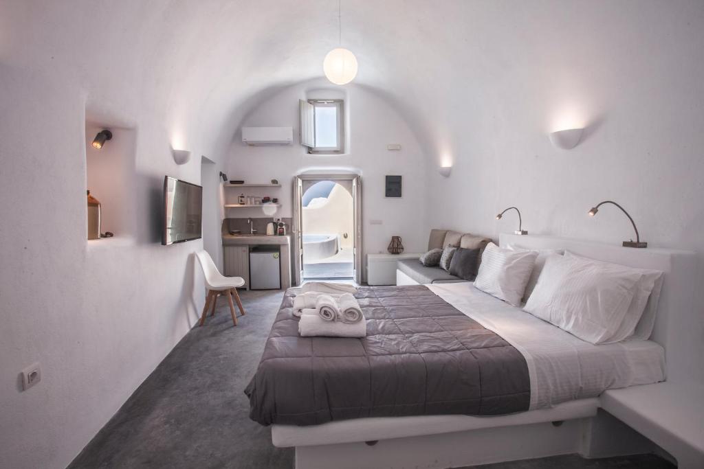 Postel nebo postele na pokoji v ubytování Cupola Suites
