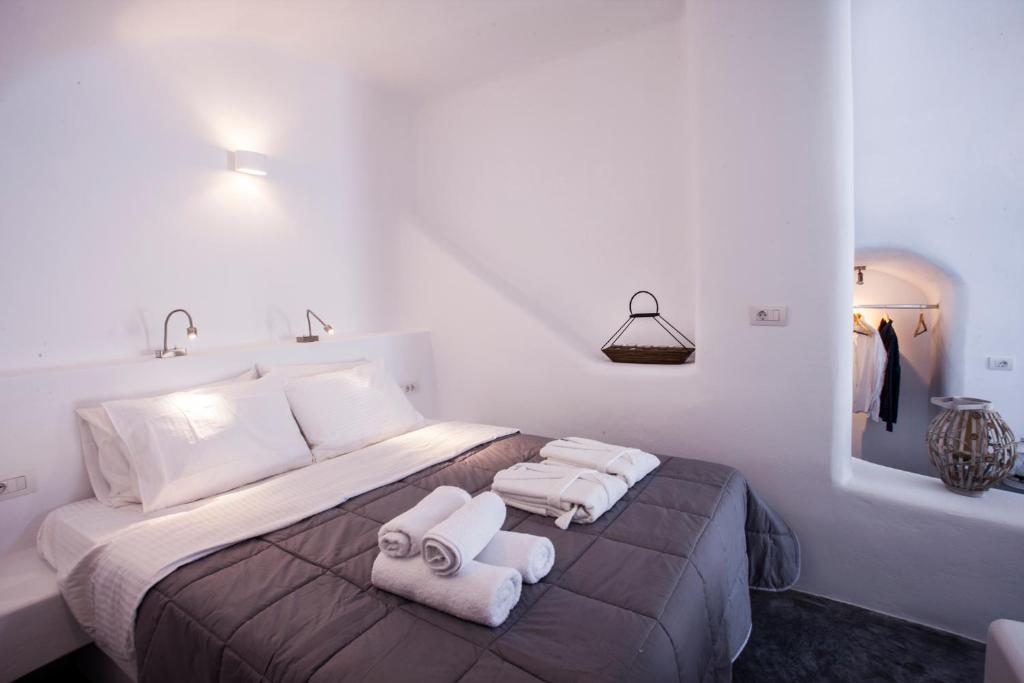 Postel nebo postele na pokoji v ubytování Cupola Suites