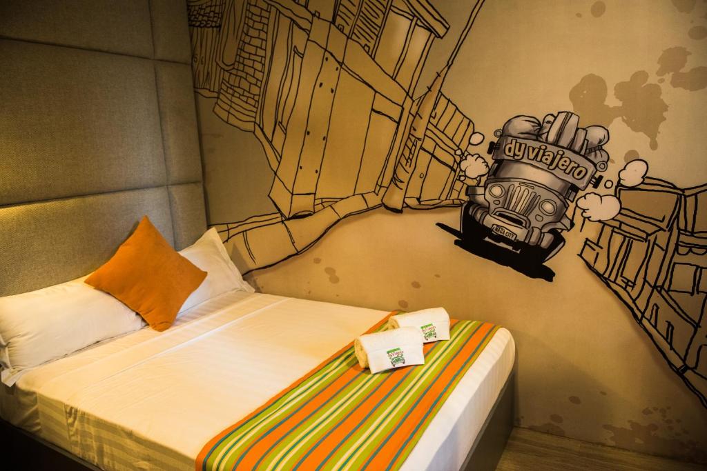 Postel nebo postele na pokoji v ubytování Dy Viajero Transient Hotel