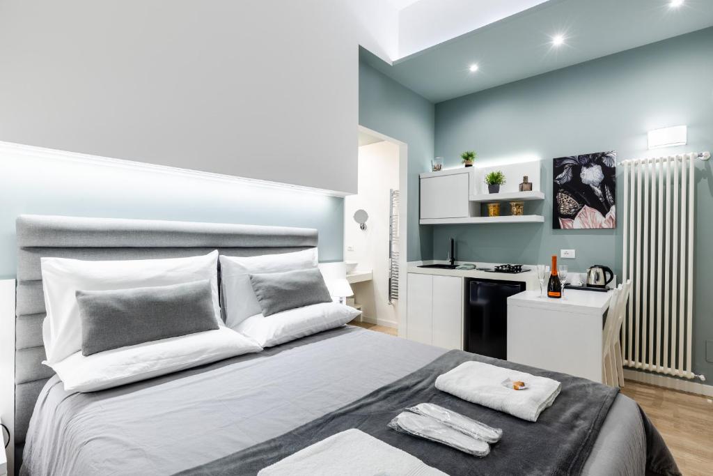 A bed or beds in a room at Residenze Chamur Via Giuseppe Sciuti