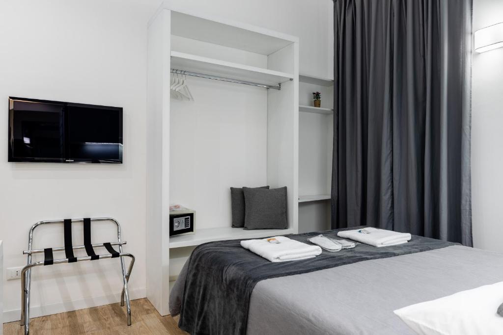 A bed or beds in a room at Residenze Chamur Via Giuseppe Sciuti