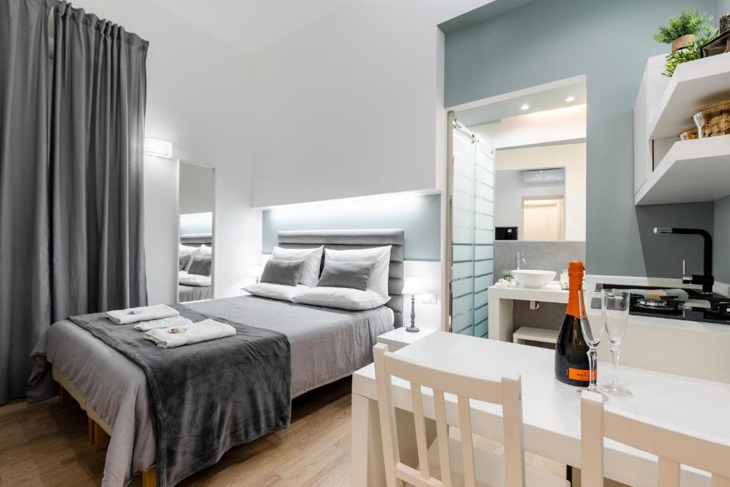 A bed or beds in a room at Residenze Chamur Via Giuseppe Sciuti