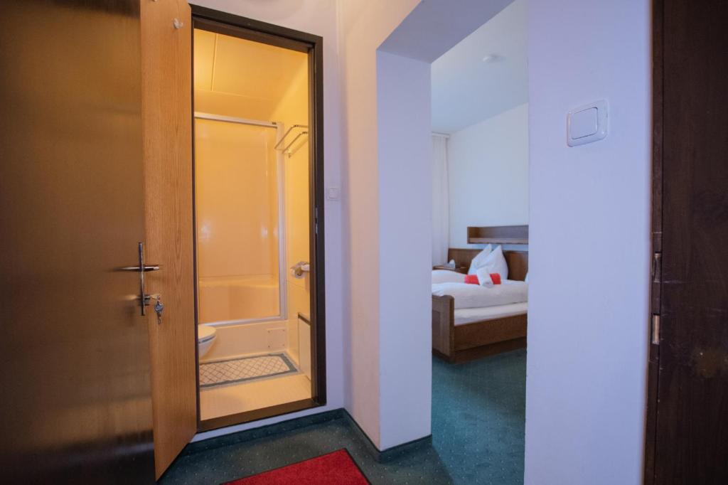 Postel nebo postele na pokoji v ubytování Hotel Vanda