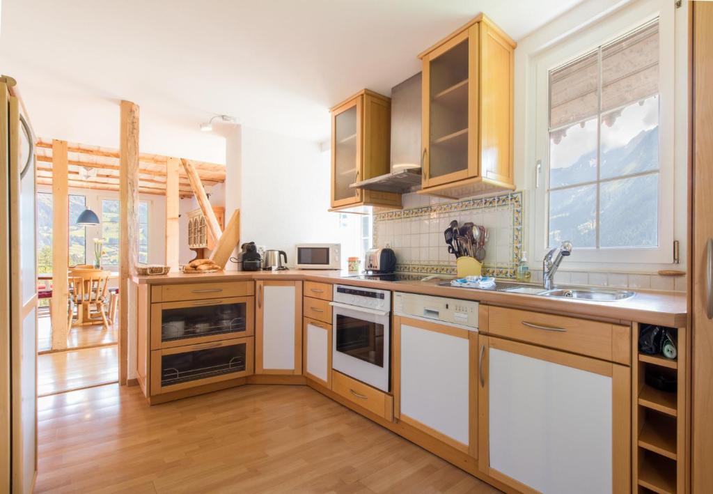 Kuchyň nebo kuchyňský kout v ubytování Chalet Hunnenfluh