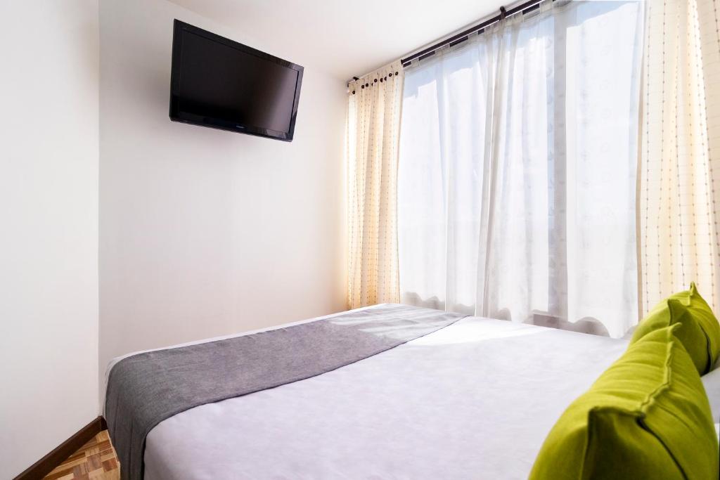 Postel nebo postele na pokoji v ubytování Ayenda 1069 Alfay