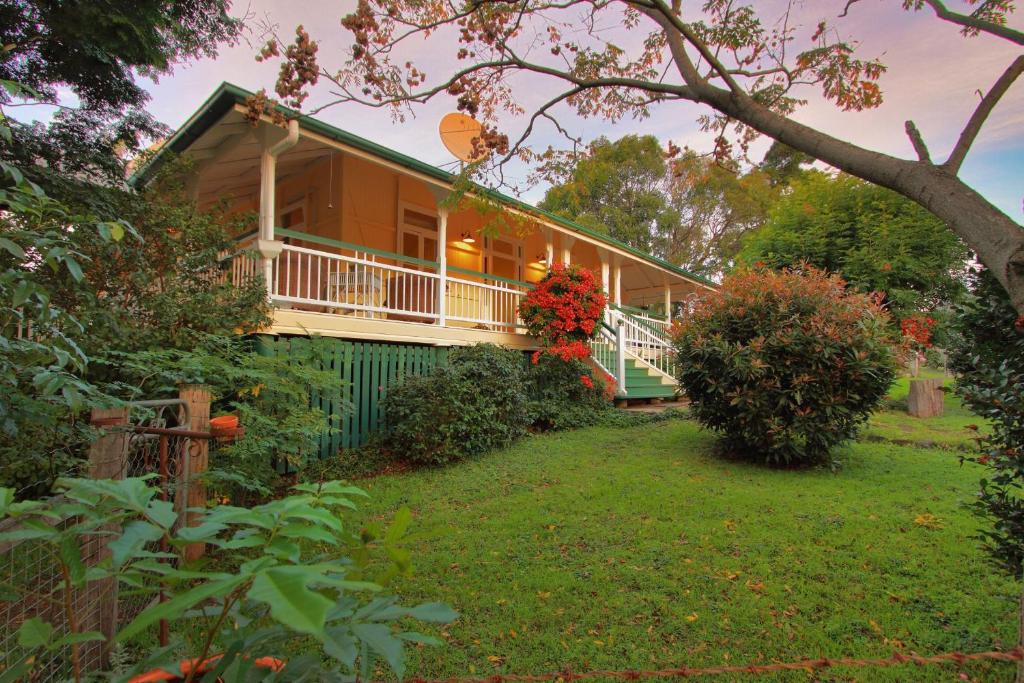 a house with a porch and a yard at Worendo Cottages in Darlington