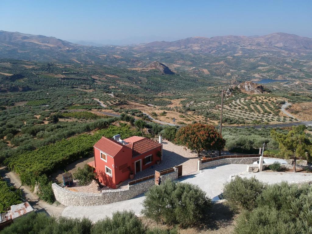 an aerial view of a house in a vineyard at ONOMY Country House Vathypetro in Archanes