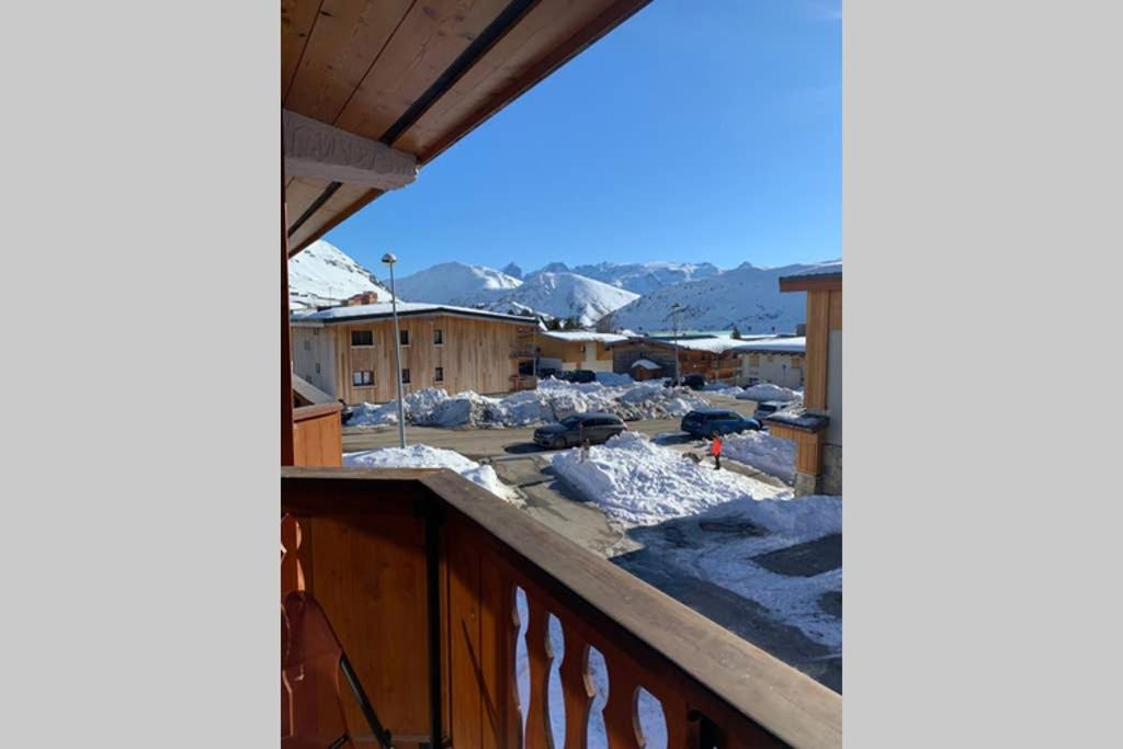 a view from the balcony of a house in the snow at Alpe d'Huez centre de la station résidence Athos in L'Alpe-d'Huez
