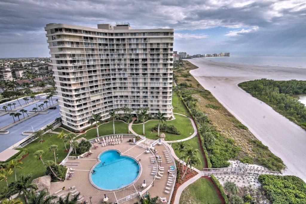 an aerial view of a large building next to the beach at Beachfront Marco Island Resort Condo with Pool! in Marco Island