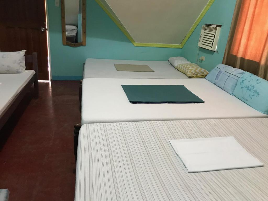 Postel nebo postele na pokoji v ubytování Oasis Resthouse