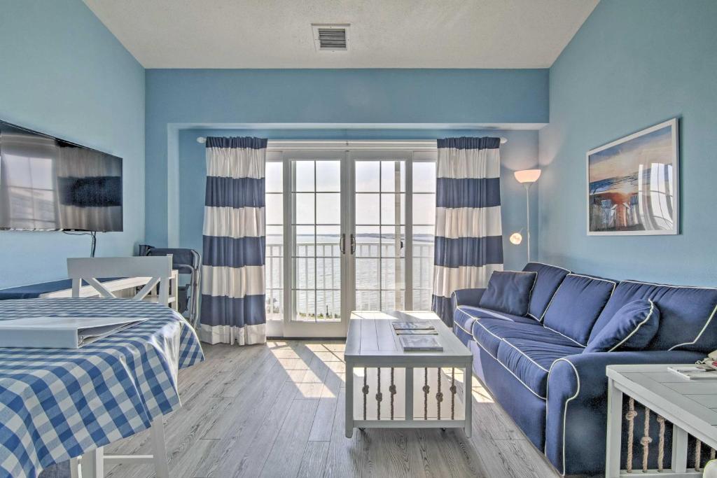 a blue living room with a couch and a bed at Newly Updated Condo with Beautiful Views and Location! in Ocean City