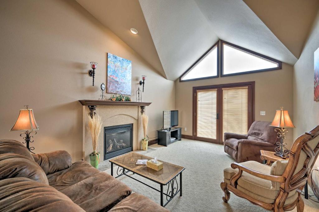 a living room with a couch and a fireplace at Cozy and Convenient Red Lodge Home Less Than 8 Mi to Slopes! in Red Lodge