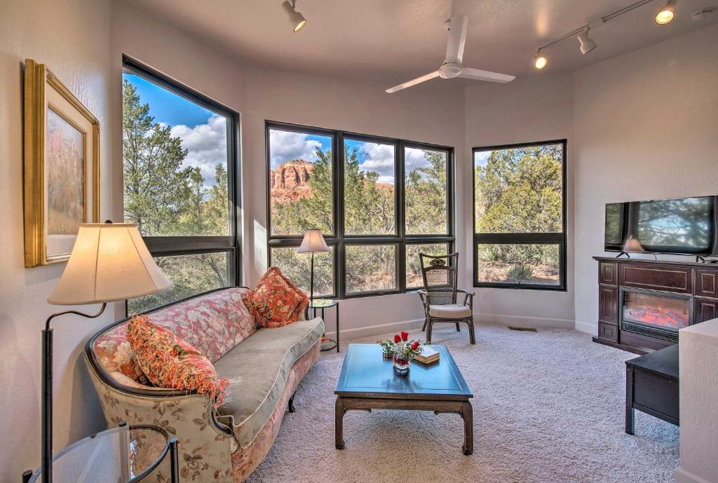 a living room with a couch and a table at Sedona Apartment with Private Patio and Red Rock Views in Sedona