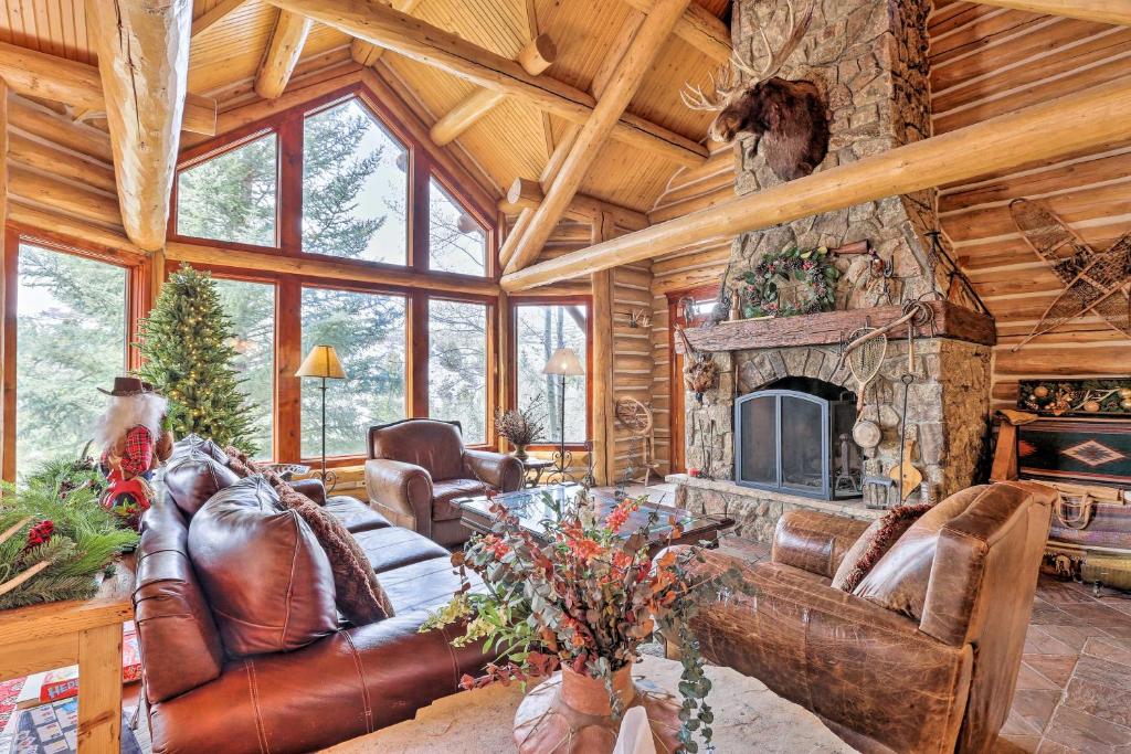 a living room with a couch and a fireplace at Secluded Mountain Cabin By Beaver Creek and Vail! in Wolcott