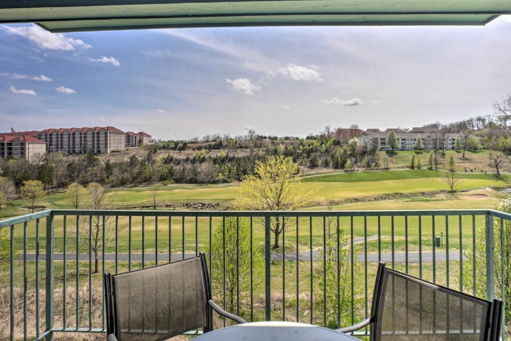 a view of a golf course from a balcony at Walk-In Condo on Golf Course with Pool Walk to Strip in Branson