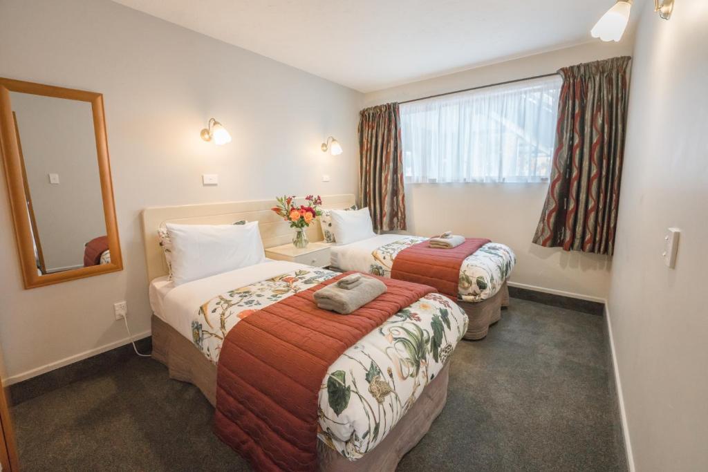 Postel nebo postele na pokoji v ubytování Strathern Motor Lodge