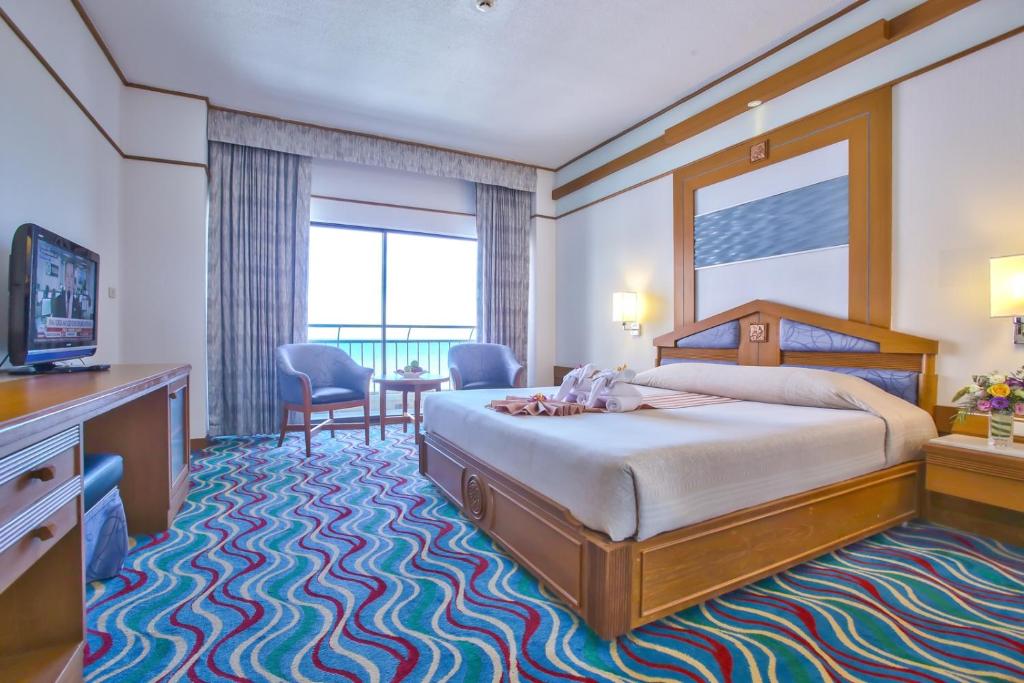 Postel nebo postele na pokoji v ubytování Asia Cha-am Hotel
