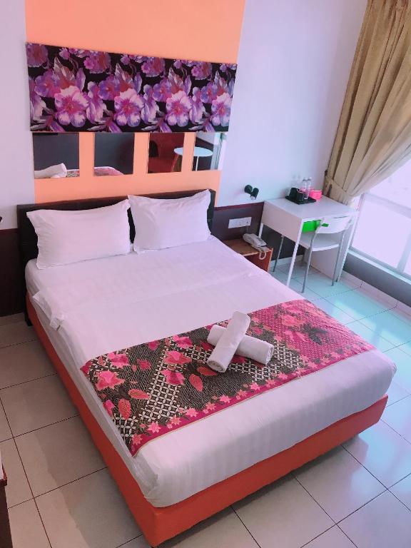 Postel nebo postele na pokoji v ubytování Langit Langi Hotel @ KLIA/KLIA2