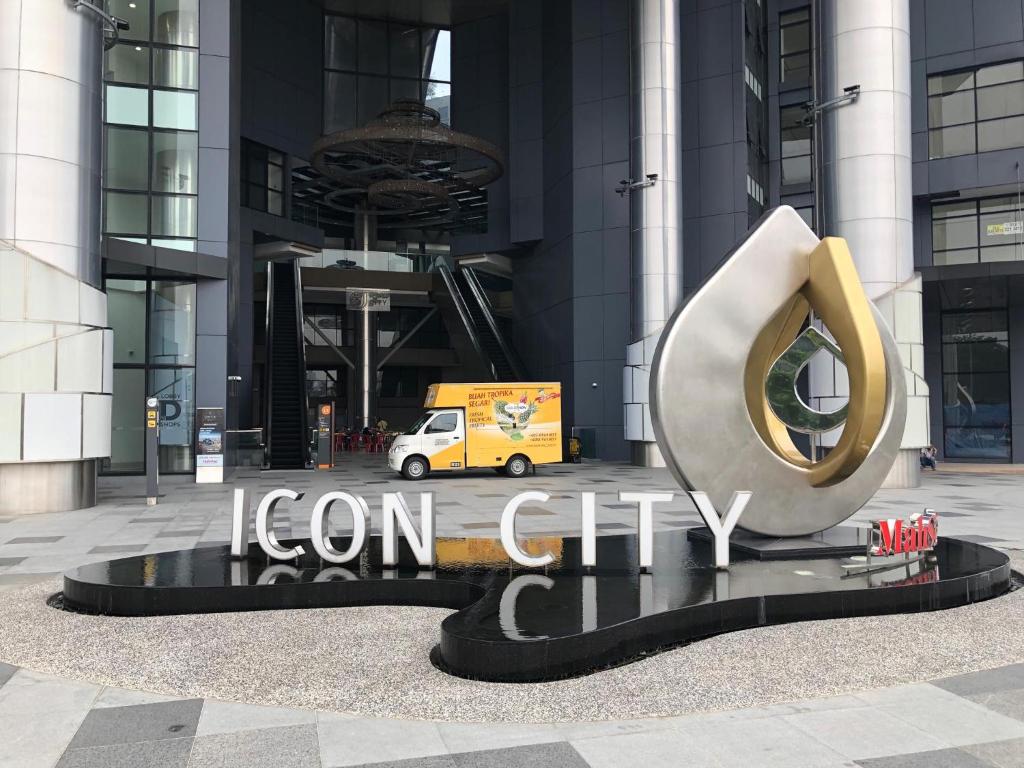 a iron city sign in front of a building at Icon City 8Pax SunwayPyramid & Lagoon CityView in Kuala Selangor