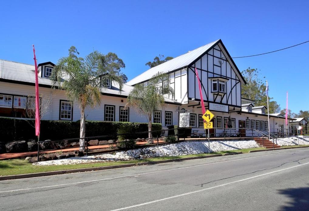 a building on the side of a street at Canungra Hotel in Canungra