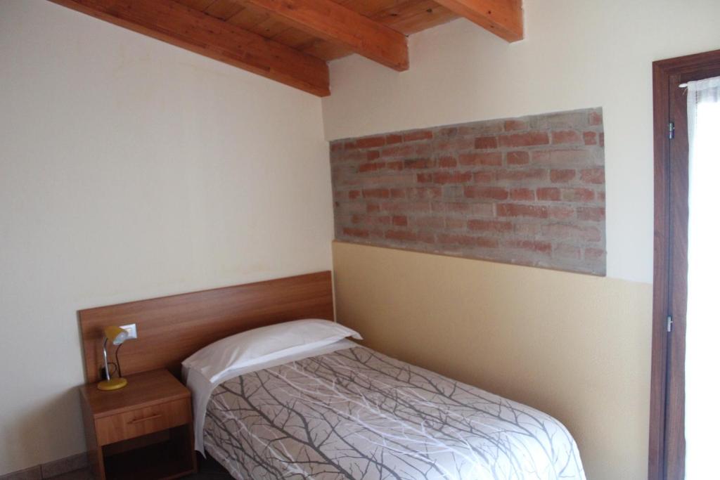 Posteľ alebo postele v izbe v ubytovaní Agriturismo Ravaglia Grande