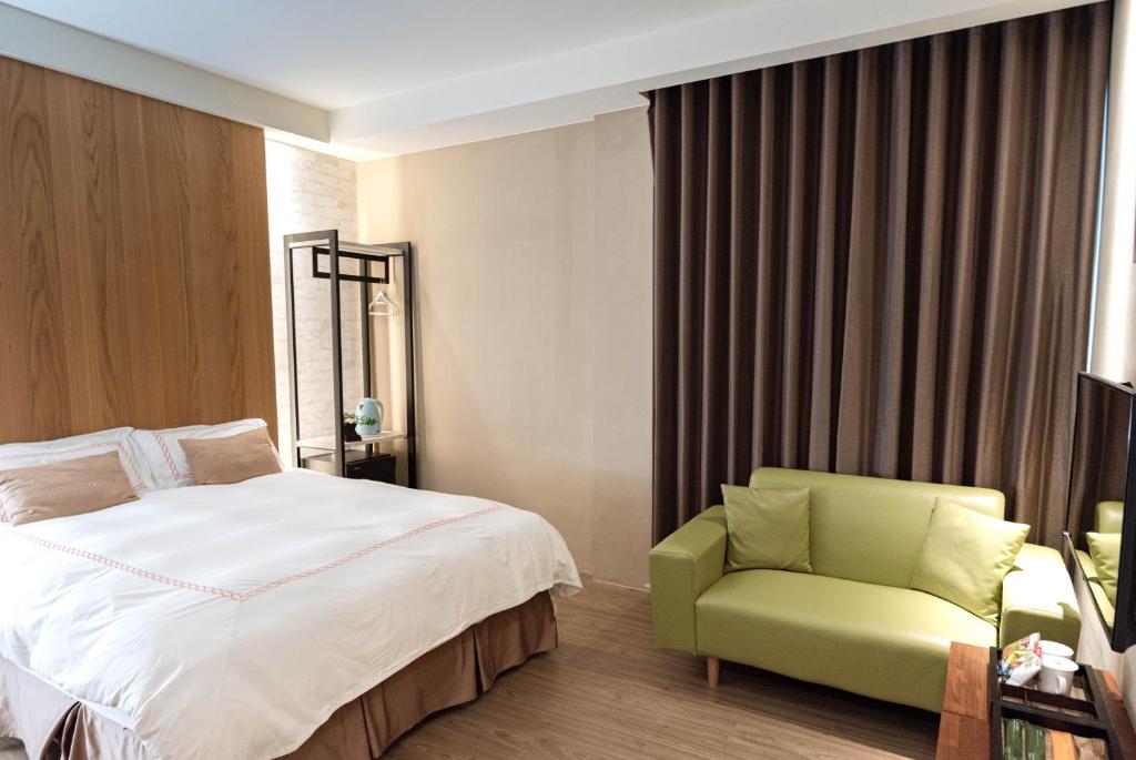Postel nebo postele na pokoji v ubytování Tianli Hotel