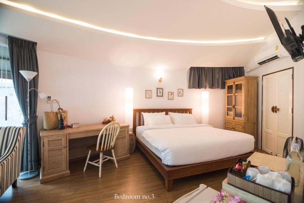 Postel nebo postele na pokoji v ubytování Koh Mak Cococape Resort